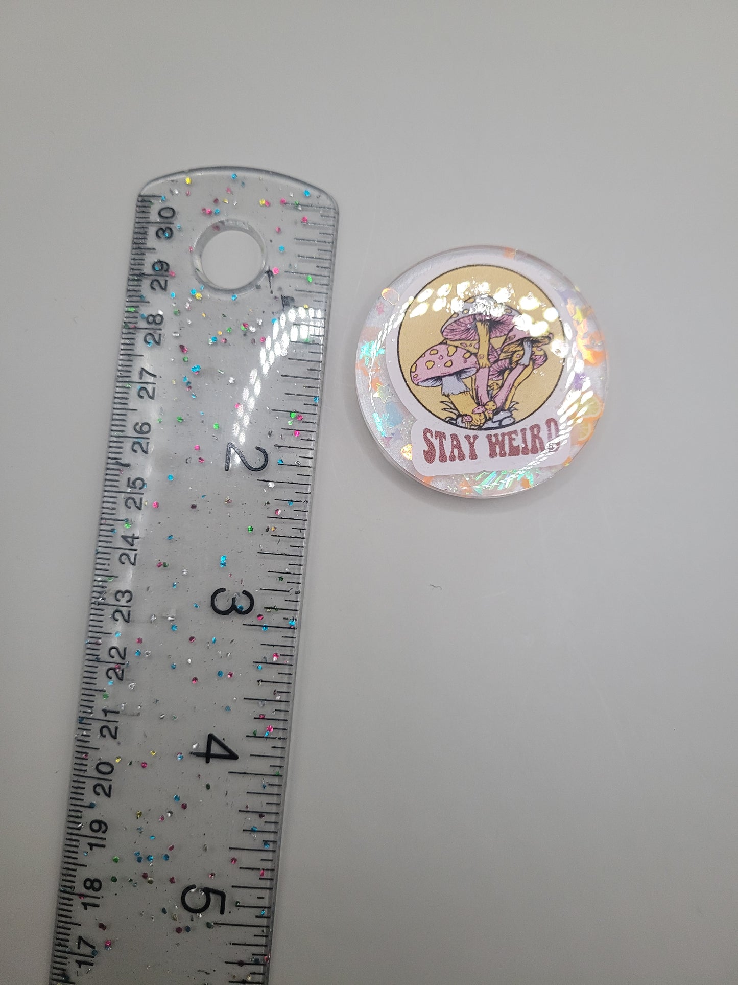Stay Weird Badge Face